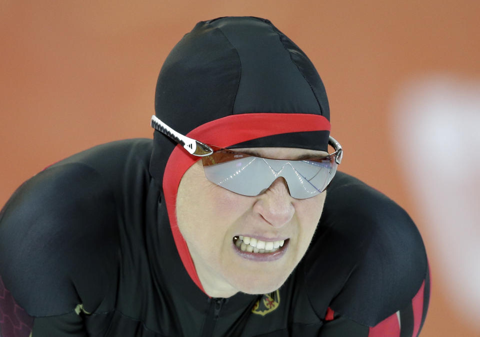 Claudia Pechstein of Germany grimaces after competing in the women's 3,000-meter speedskating race at the Adler Arena Skating Center during the 2014 Winter Olympics, Sunday, Feb. 9, 2014, in Sochi, Russia. (AP Photo/Patrick Semansky)