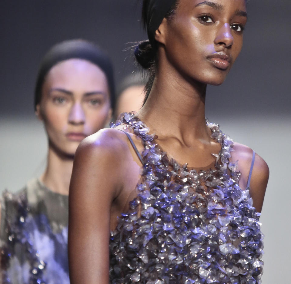 Fashion from the Vera Wang Spring 2014 collection is modeled on Tuesday, Sept. 10, 2013 in New York. (AP Photo/Bebeto Matthews)