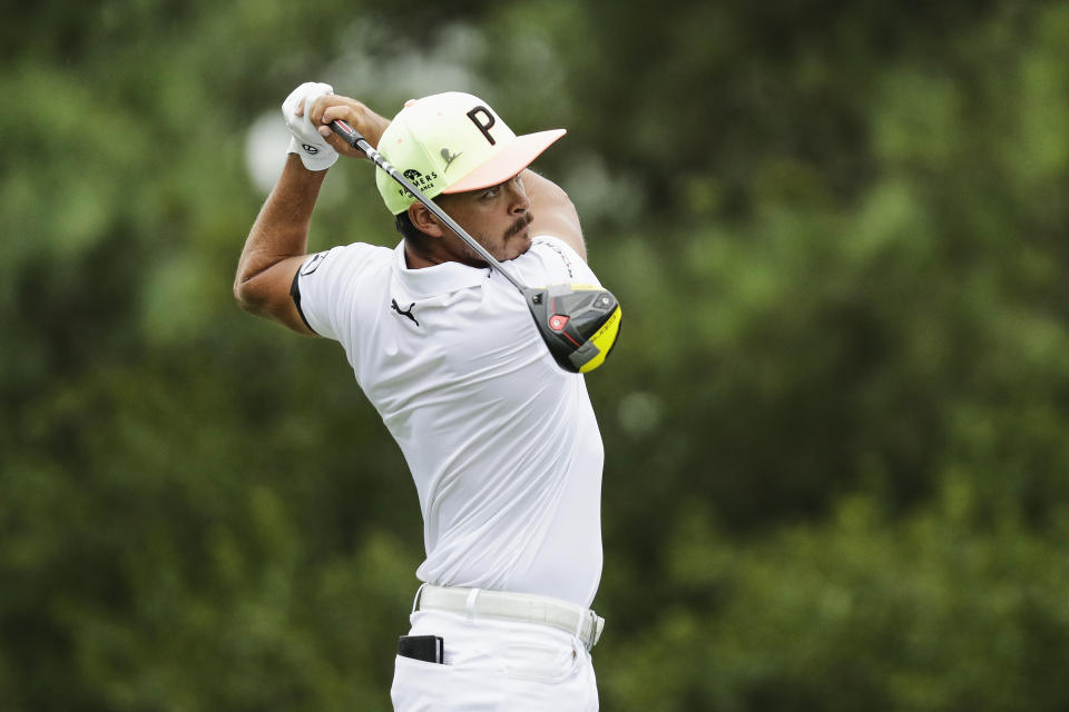 Rickie Fowler watches his tee shot on the 17th hole during the first round of the World Golf Championship-FedEx St. Jude Invitational Thursday, July 30, 2020, in Memphis, Tenn. (AP Photo/Mark Humphrey)