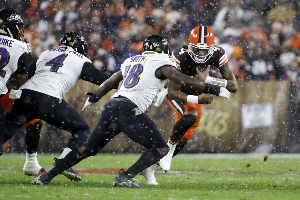 FILE - Baltimore Ravens linebacker Roquan Smith (18) attempts to tackle Cleveland Browns quarterback Deshaun Watson during an NFL football game, Dec. 17, 2022, in Cleveland. Watson was safe on the sideline the last time the Browns played the Ravens. He'll be in harm's way on Sunday, Nov. 12, 2023. (AP Photo/Kirk Irwin, File)