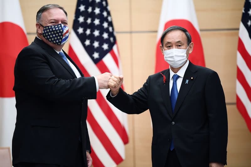 Japan's Prime Minister Suga and U.S. Secretary of State Pompeo pose prior to their meeting at the prime minister's office in Tokyo