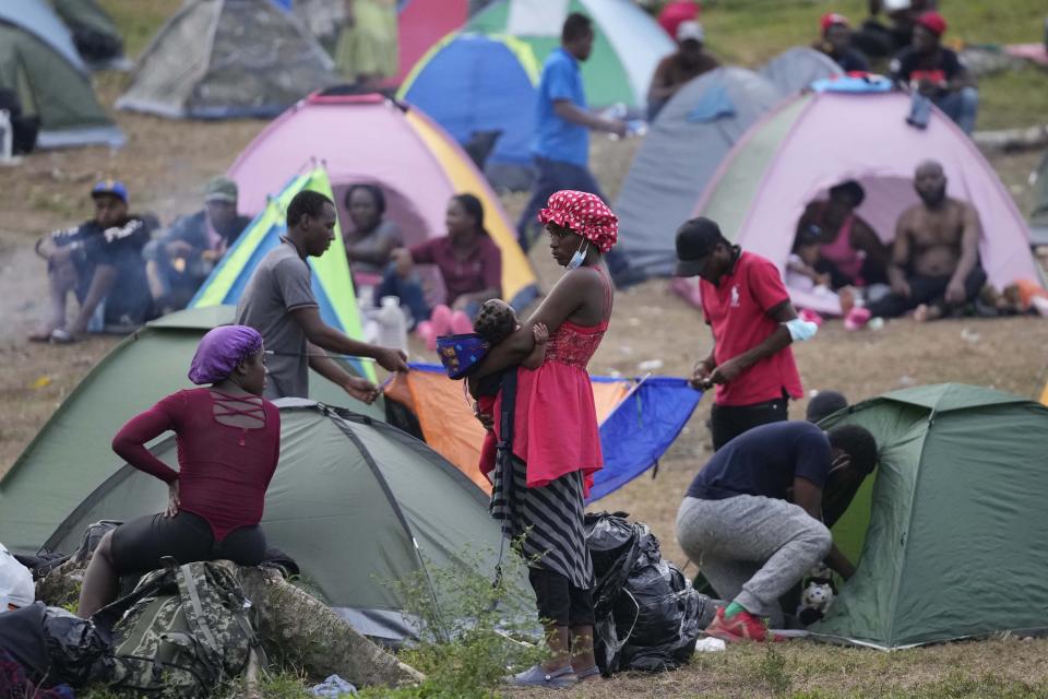 Migrants rest at a camp in Acandi, Colombia, Tuesday, Sept. 14, 2021. The migrants, following a well-beaten, multi-nation journey towards the U.S., will continue their journey through the jungle known as the Darien Gap. (AP Photo/Fernando Vergara)