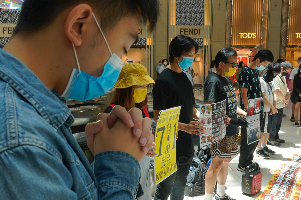 Protesters gather at a shopping mall in Central during a pro-democracy protest against Beijing's national security law in Hong Kong, Tuesday, June 30, 2020. Hong Kong media are reporting that China has approved a contentious law that would allow authorities to crack down on subversive and secessionist activity in Hong Kong, sparking fears that it would be used to curb opposition voices in the semi-autonomous territory. (AP Photo/Vincent Yu)