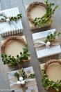 <p>Using faux boxwood or fresh stems (which will smell amazing), attach the greenery to tiny grapevine wreaths for another gift the recipient can take home.<br></p><p><strong>Get the tutorial at <a href="https://www.nickandalicia.com/2015/12/mini-boxwood-wreath-tutorial.html/" rel="nofollow noopener" target="_blank" data-ylk="slk:Nick + Alicia;elm:context_link;itc:0;sec:content-canvas" class="link ">Nick + Alicia</a>. </strong> </p>