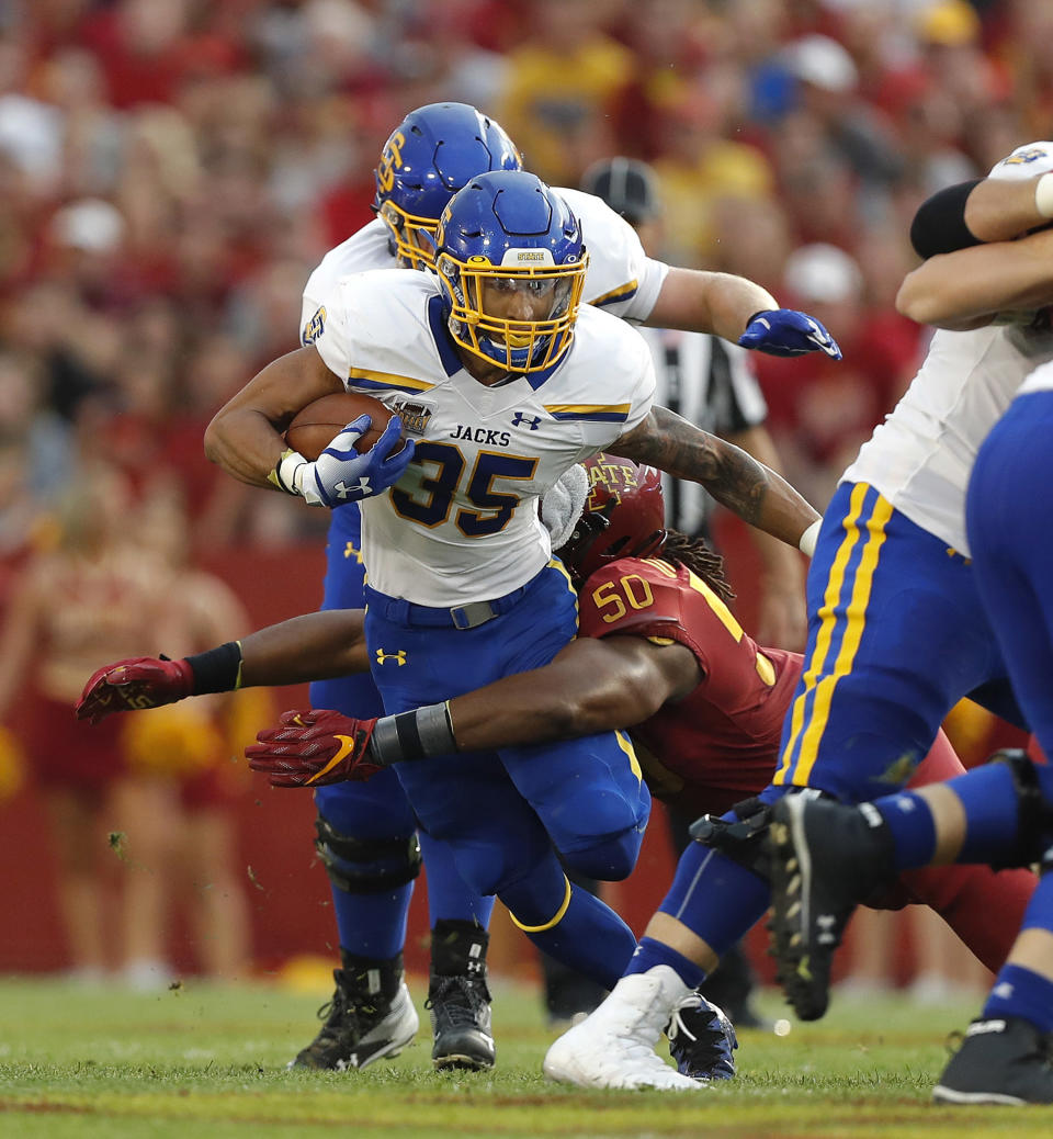 South Dakota State running back Isaac Wallace, left, is taken down by Iowa State defensive end Eyioma Uwazurike during the first half of an NCAA college football game, Saturday, Sept. 1, 2018, in Ames, Iowa. (AP Photo/Matthew Putney)