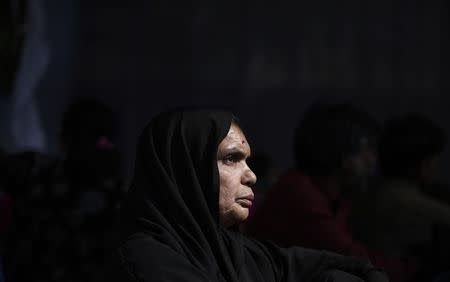 A victim of the Bhopal gas tragedy, a gas leak from a Union Carbide pesticide plant that killed at least 3500 people, attends a sit-in protest in New Delhi November 10, 2014. REUTERS/Adnan Abidi