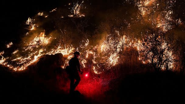 PHOTO: A firefighter works to mitigate the flames as the Oak Fire burns near Mariposa, Calif., July 22, 2022. (Tracy Barbutes/Reuters)