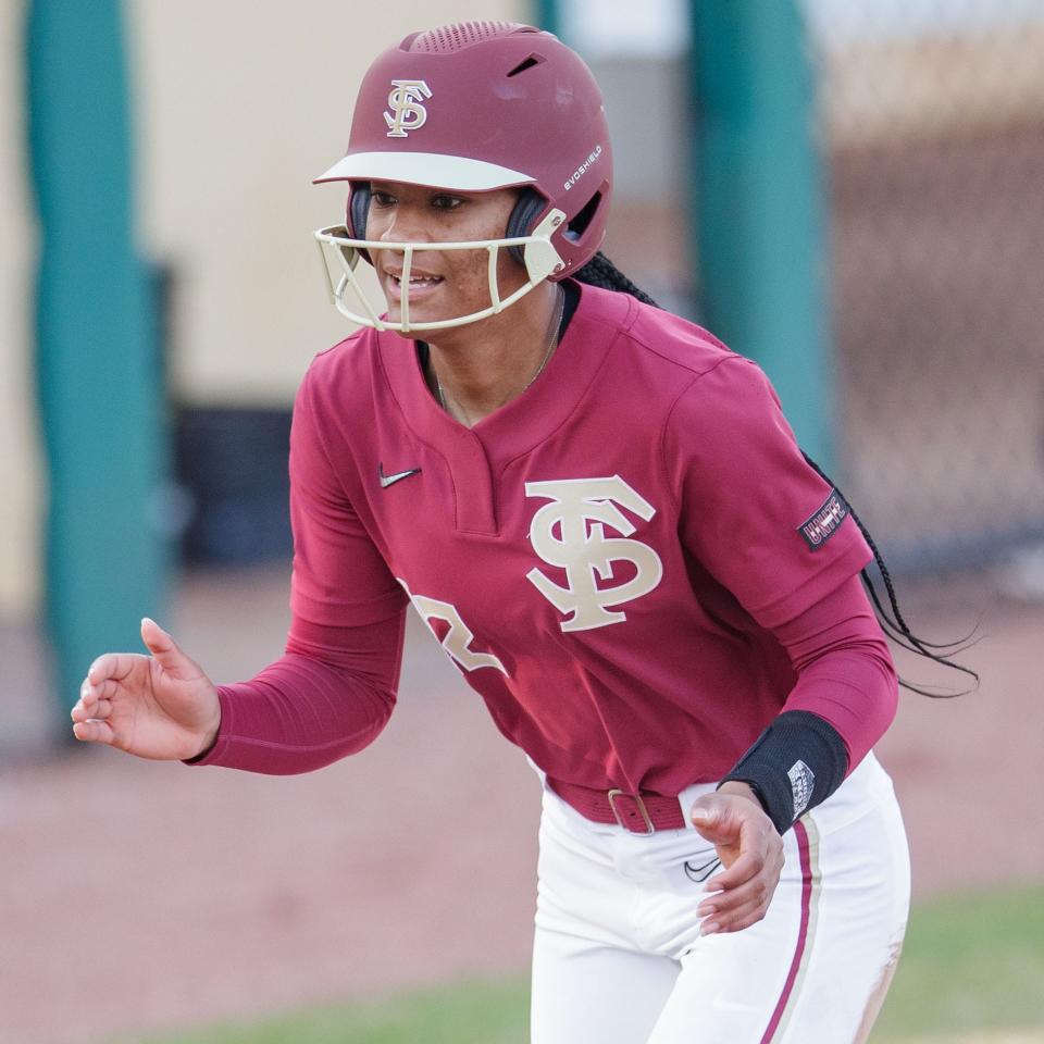 Florida State infielder Amaya Ross cheers as she makes her way to home plate in a February game against Mercer.