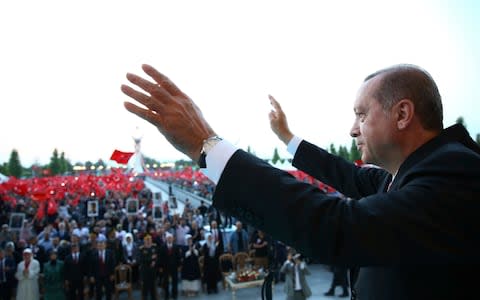 Turkey's President Recep Tayyip Erdogan waves to supporters - Credit: Presidency press service/AP