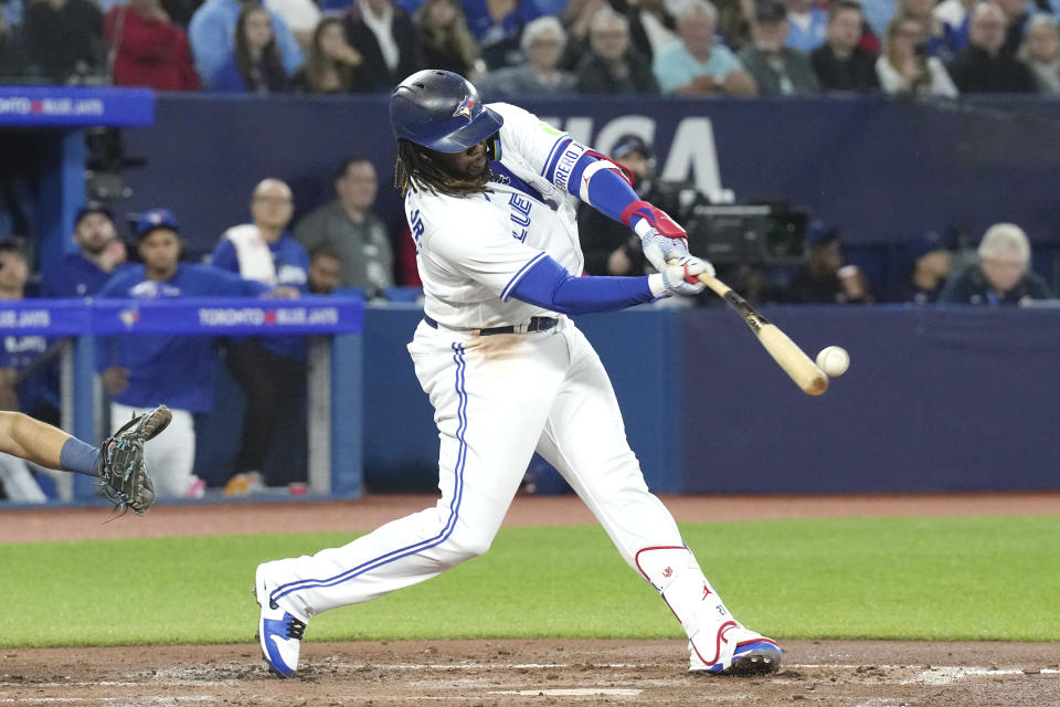 Toronto Blue Jays Vladimir Guerrero Jr. hits a single off Tampa Bay Rays relief pitcher Zack Littell during the third inning of a baseball game Friday, Sept. 29, 2023, in Toronto. (Chris Young/The Canadian Press via AP)