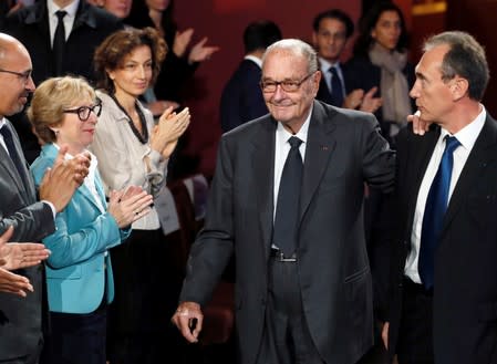 FILE PHOTO: File photo of former French President Jacques Chirac arriving to attend the award ceremony for the Prix de la Fondation Chirac at the Quai Branly Museum in Paris