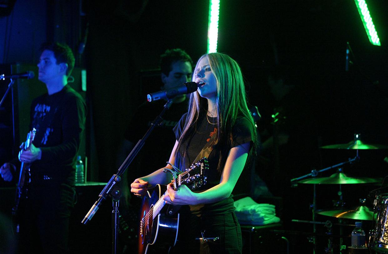 Singer Avril Lavigne performs on stage during her secret fan club gig at the Camden Monarch on April 27, 2004 in London.