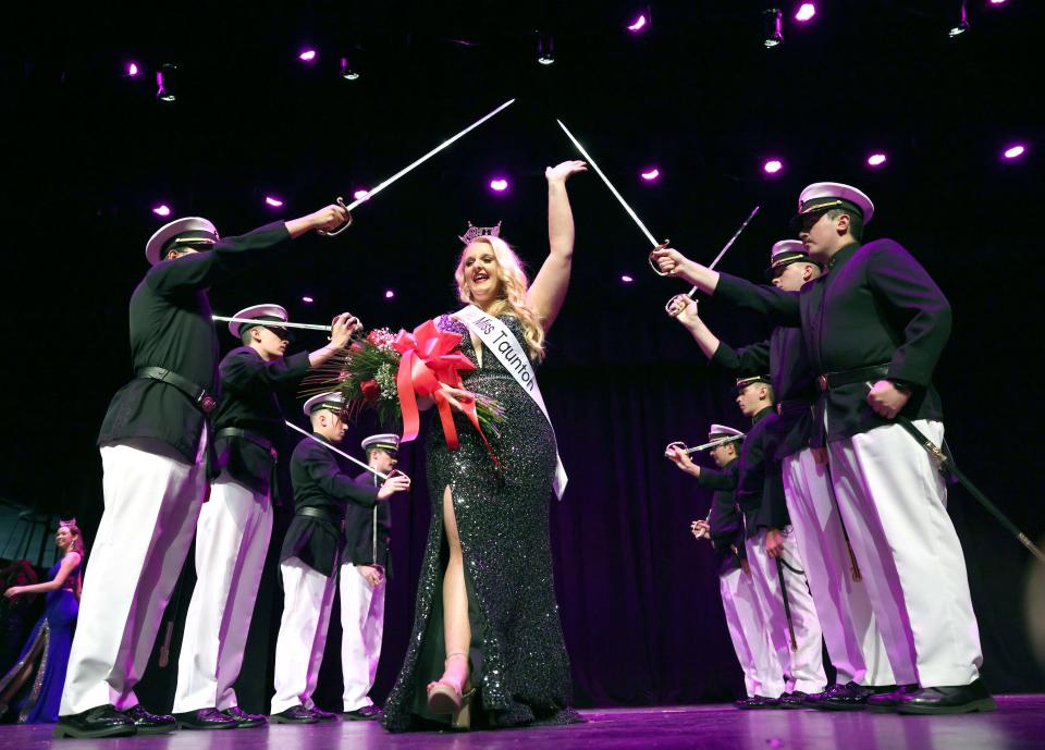 Miss Taunton 2023 Lily Jeswald walks through the Mass Maritime guards during Saturday night's Miss Taunton competition at Taunton High School on Nov. 5, 2022.  