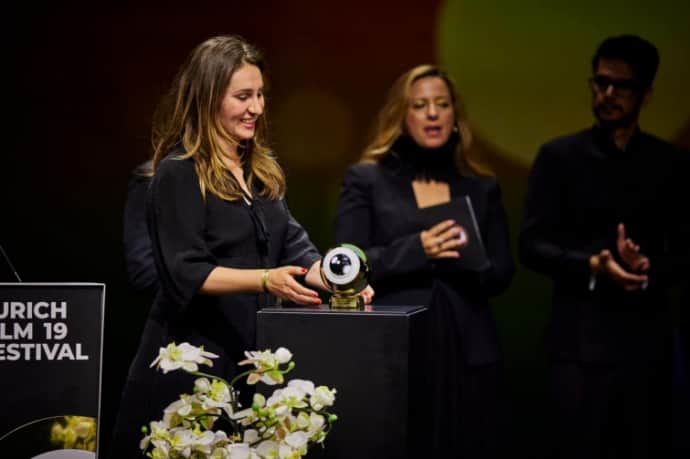 Producer Kseniia Marchenko with the award in Zurich.