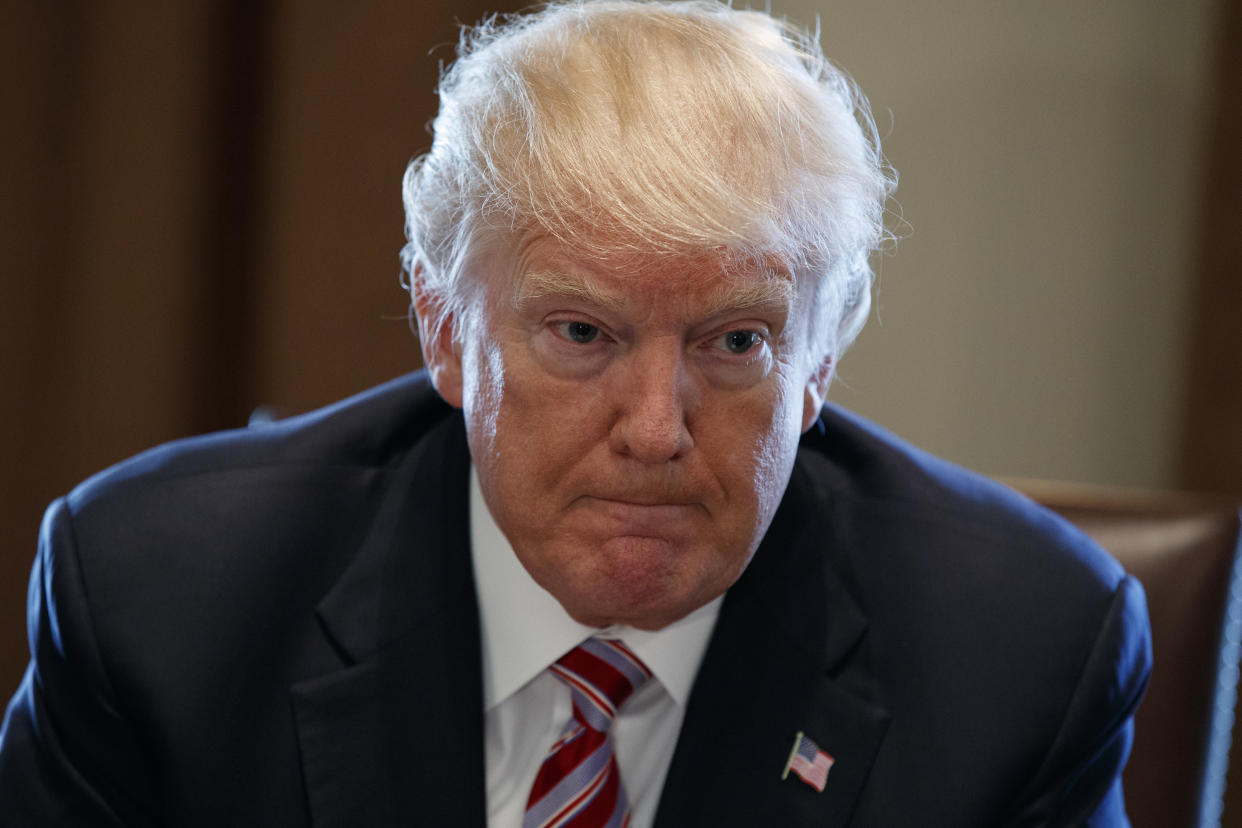 President Donald Trump listens during a meeting with lawmakers about trade policy in the Cabinet Room of the White House, Tuesday, Feb. 13, 2018, in Washington. (Photo: Evan Vucci/AP)