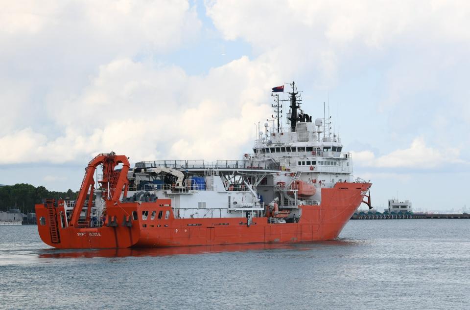 In this April 21, 2021, photo, the MV Swift Rescue, a submarine support and rescue vessel, leaves for Indonesia from Singapore. Indonesia's navy ships on Thursday, April 22, were intensely searching for a submarine that likely fell too deep to retrieve, making survival chances for the 53 people on board slim. Neighboring countries rushed their rescue ships to support the complex operation. (Ng Eng Hen Facebook page via AP)