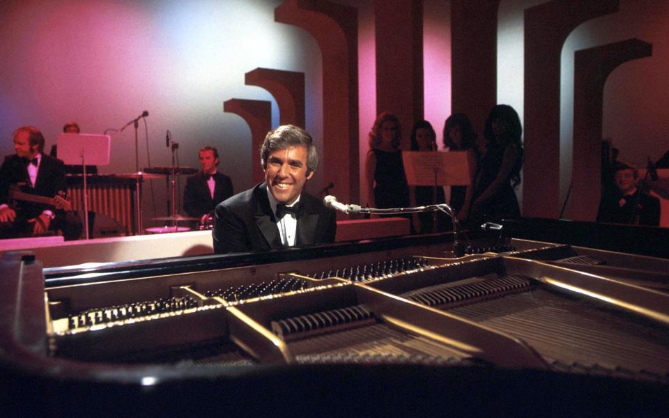 Burt Bacharach performs on his piano circa 1968 in Los Angeles, California - Martin Mills