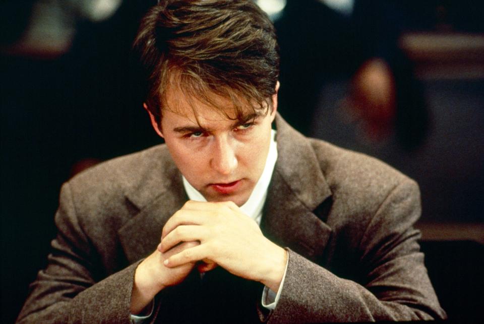 A man sits in a courtroom