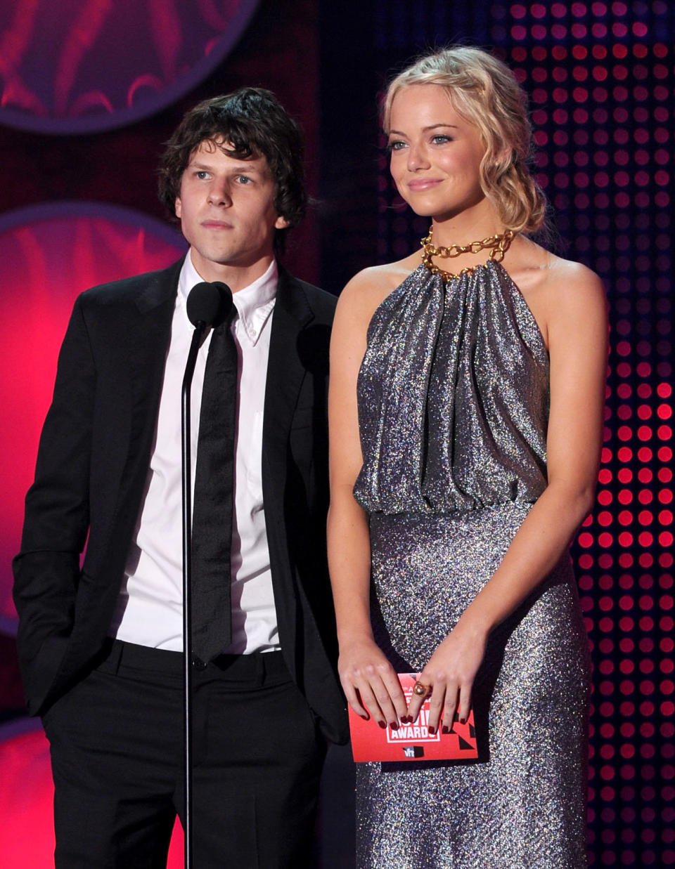 Jesse Eisenberg and Emma Stone speak onstage during the 16th annual Critics' Choice Movie Awards in 2011.