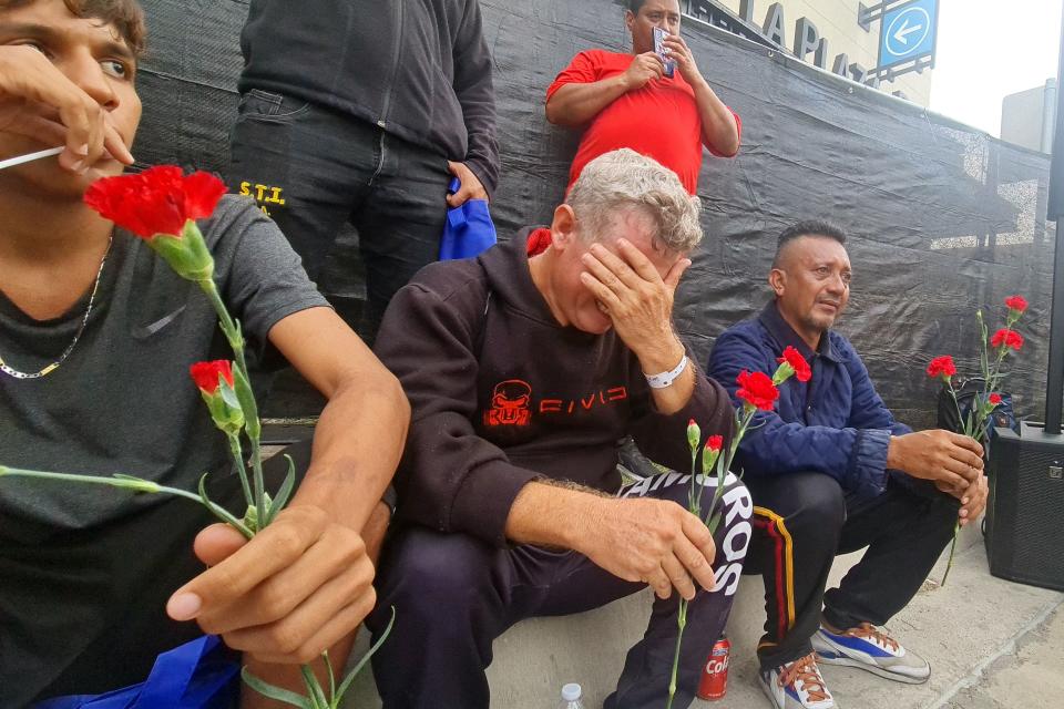 Wilmer Colima (C), mourns his step son, Enyerbeth Cabarcas, 23, who allegedly was one of the eight victims after an SUV plowed into a crowd, in Brownsville, Texas on 8 May  2023 (AFP via Getty Images)