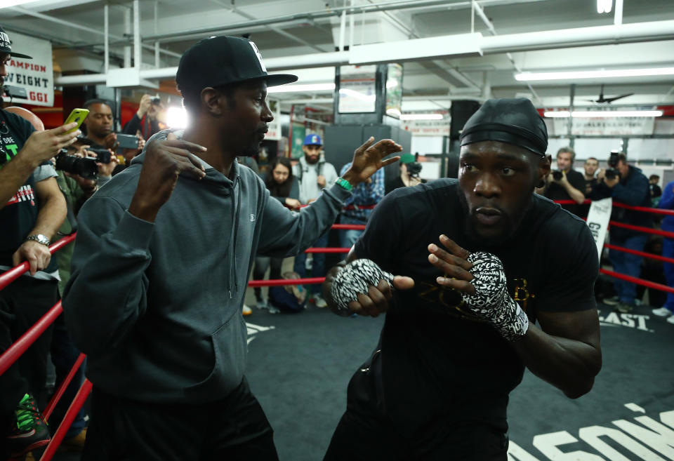 Trainer Mark Breland (L) puts WBC heavyweight champion Deontay Wilder through his paces Wednesday in a workout at Gleason’s Gym prior to his bout on Saturday with Bermane Stiverne in Brooklyn. (Getty Images)