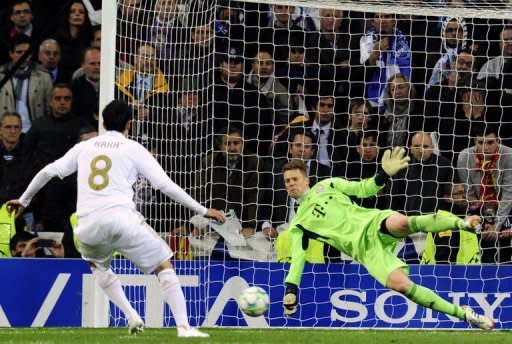 Bayern Munich goalkeeper Manuel Neuer stops a penalty kick from Real Madrid's Kaka during the Champions League second leg semi-final against Bayern Munich at the Santiago Bernabeu stadium on Wednesday