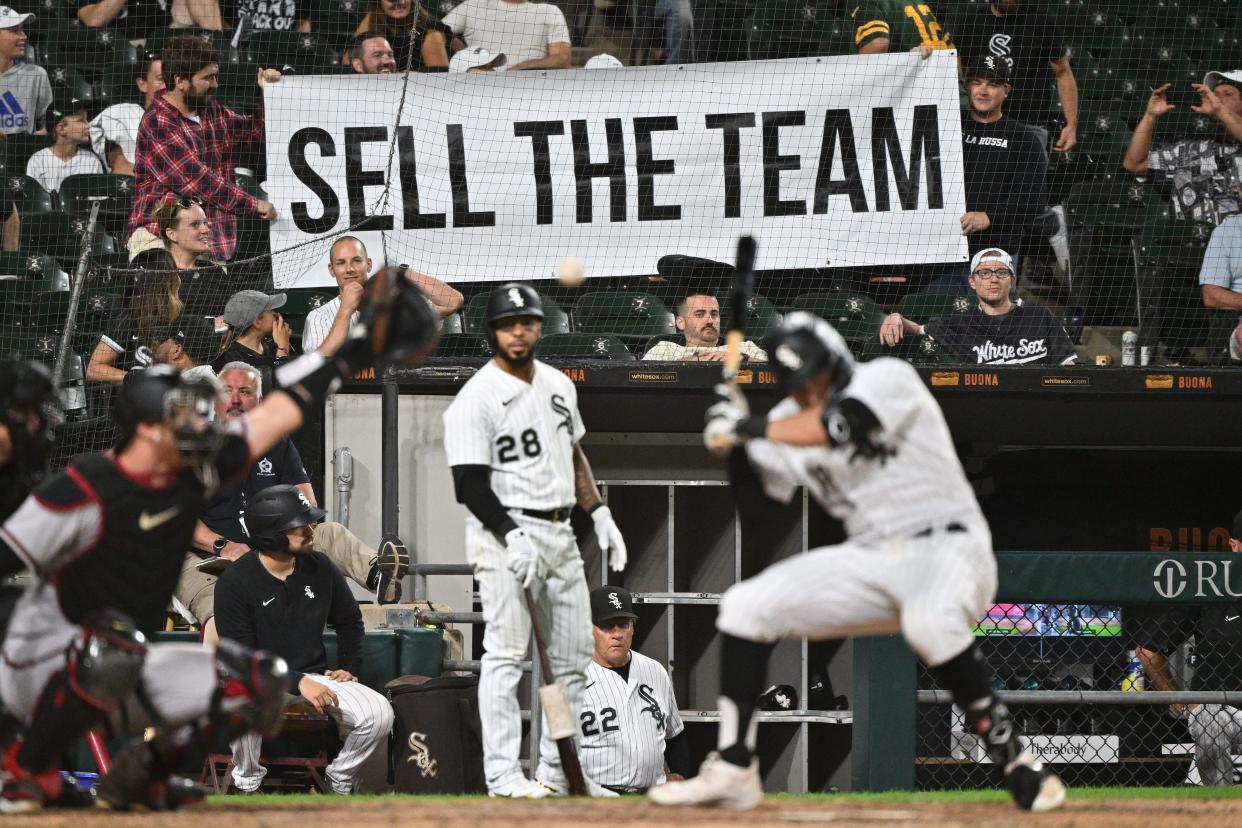 Frustrated Chicago White Sox fans hold up a sign urging owner Jerry Reinsdorf to sell the team during a game in 2022.