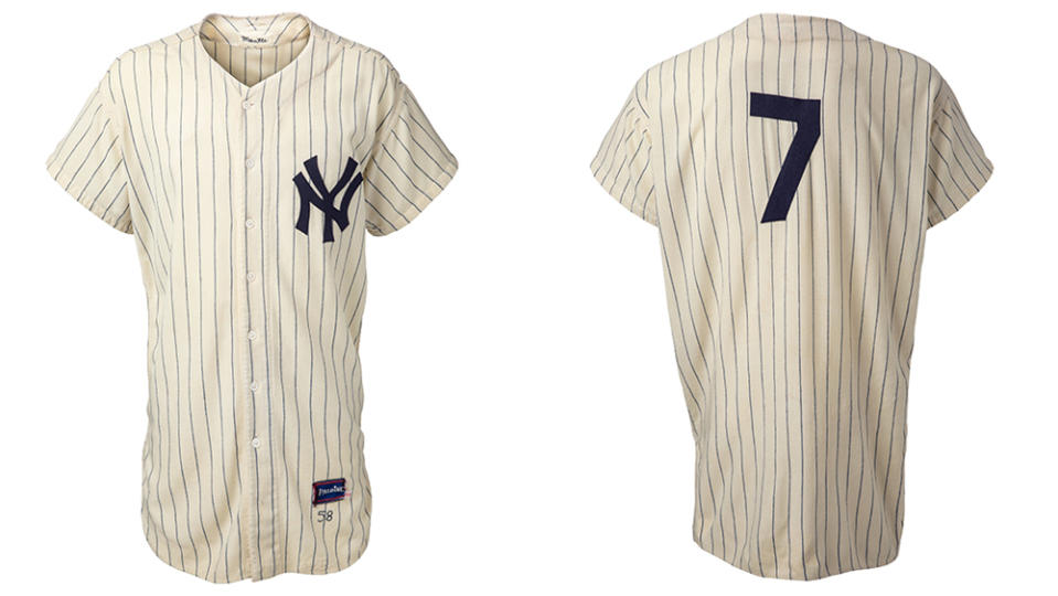 Front and backside views of Mantle's vintage New York Yankees jersey on auction.