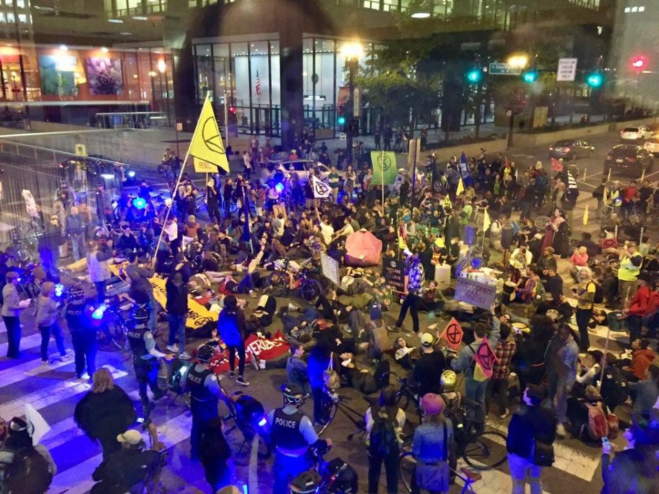 Protesters march through the streets to demand action on climate change in Chicago, Illinois on Oct. 7, 2019.