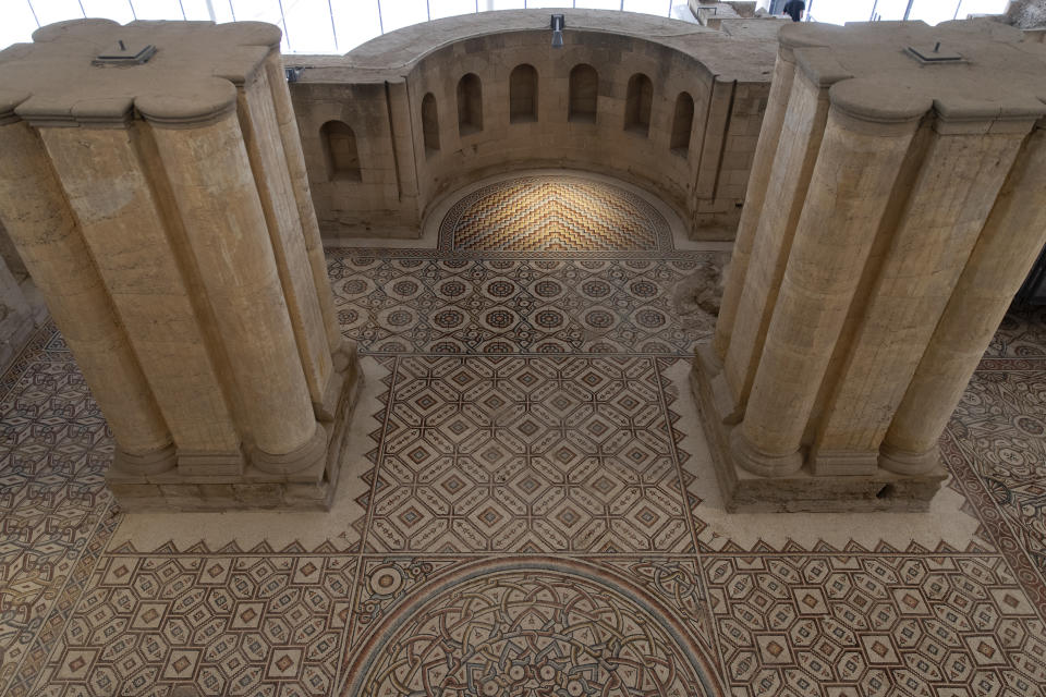 A restored section at the site of a 7th century, 827 square meter (8900 square ft) mosaic that was opened to the public, at the Islamic archaeological site of Hisham Palace, north of the West Bank city of Jericho, Thursday, Oct. 28, 2021. One of the Occupied West Bank's most famous archaeological sites, home to one of the Islamic world's largest mosaics, has been fitted with a dome covering and an aerial walkway, after it underwent a Japanese funded multi million dollar project, that allows tourists to visit the site without damaging the mosaic and also to protects the ancient ruins from bad weather. (AP Photo/Nasser Nasser)