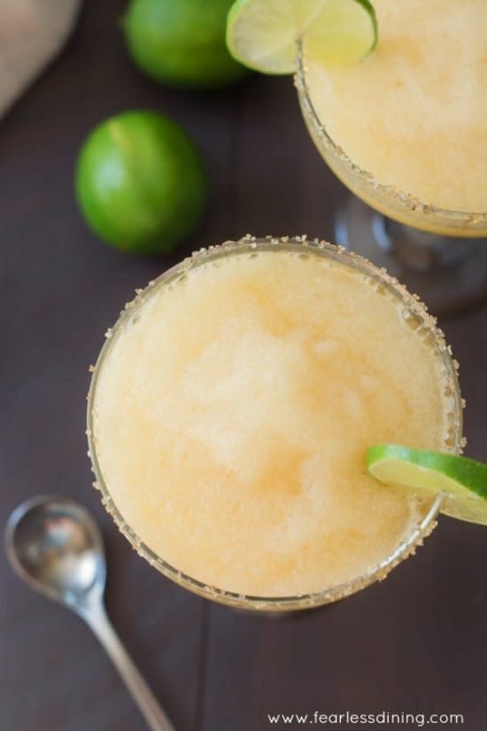 <strong>Get the <a href="https://www.fearlessdining.com/frozen-peach-margaritas-with-ginger-sugar-rim/" target="_blank">Frozen Peach Margaritas</a> recipe from Fearless Dining</strong>