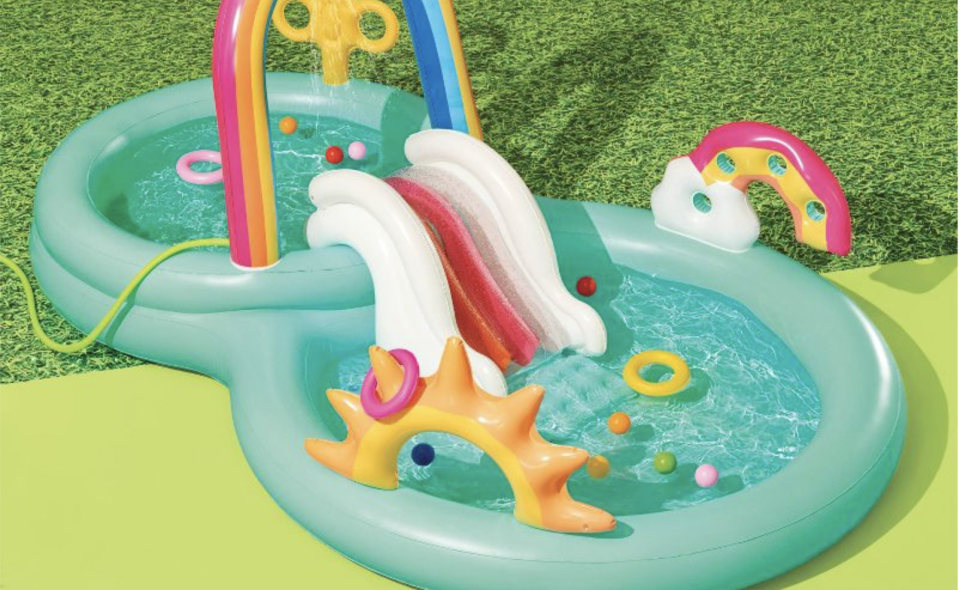 A rainbow kiddie pool and slide