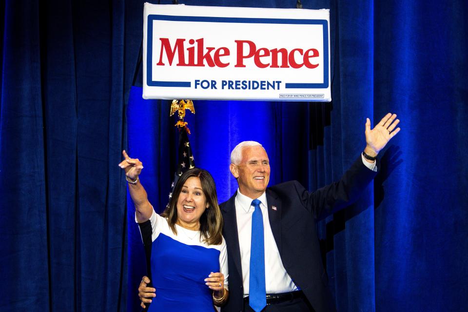 Former Vice President Mike Pence and his wife, Karen Pence, take the stage during a campaign announcement rally at the FFA Enrichment Center on the DMACC campus on Wednesday, June 7, 2023, in Ankeny.