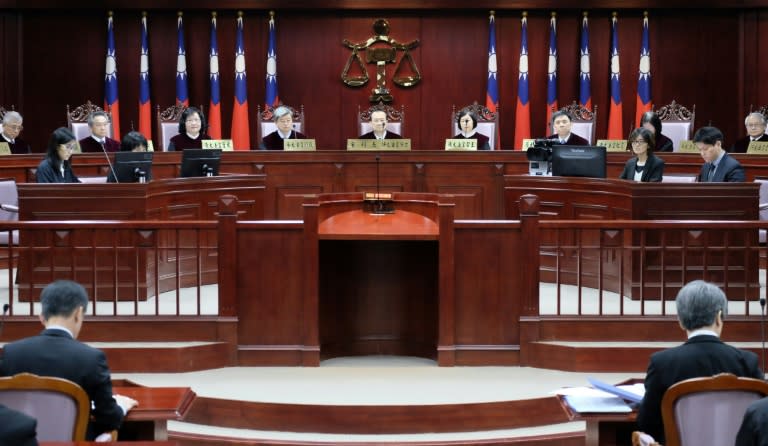 A panel of 14 grand justices will make the ruling in a case that centres on whether Taiwan's current law is unconstitutional. 