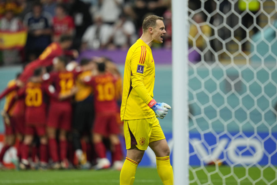 Germany's goalkeeper Manuel Neuer reacts after Spain's Alvaro Morata scored his side's opening goal during the World Cup group E soccer match between Spain and Germany, at the Al Bayt Stadium in Al Khor , Qatar, Sunday, Nov. 27, 2022. (AP Photo/Julio Cortez)