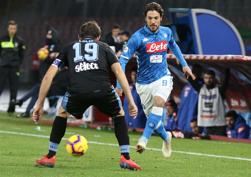 Lazio's Senad Lulic, left, and Napoli's Simone Verdi go for the ball during the Serie A soccer match between Napoli and Lazio at the San Paolo Stadium in Naples, Italy, Sunday, Jan. 20, 2019. (Cesare Abbate/ANSA via AP)