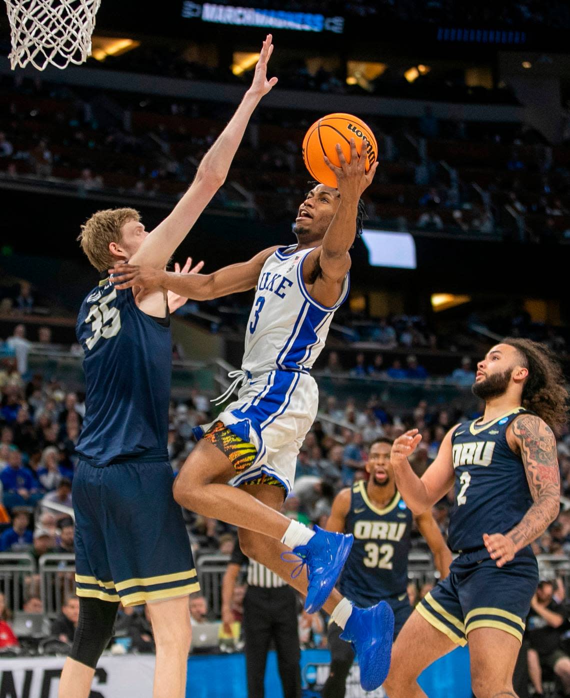 Duke’s Jeremy Roach (3) drives to the basket against Oral Roberts’ Connor Vanover (35) in the second half during the first round of the NCAA Tournament on Thursday, March 16, 2023 at the Amway Center in Orlando, Fla. Roach lead all scores with 23 points in the Blue Devils’ 74-51 victory. Robert Willett/rwillett@newsobserver.com