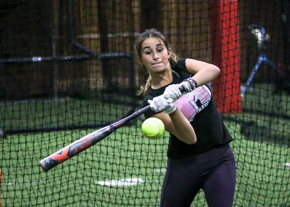 Kia Furtado is completely locked in on the ball during her hitting session at Inside The Park Batting Cages