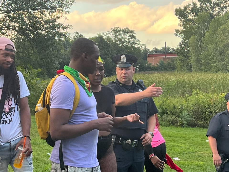 About a dozen police officers worked to clear the park after the festival was called off early.