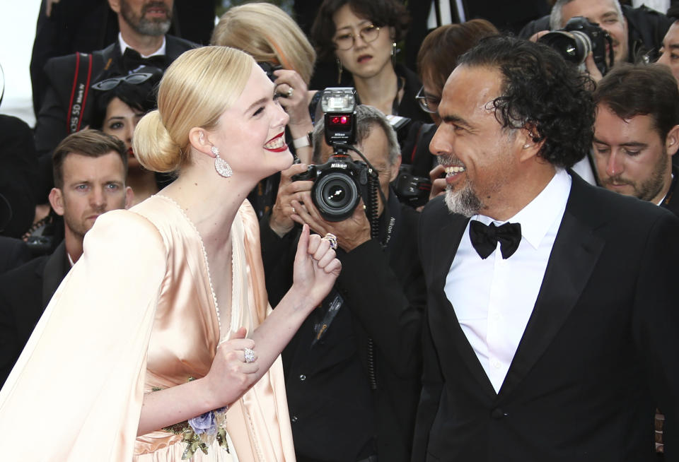 Jury member Elle Fanning, left, and jury president Alejandro Gonzalez Inarritu pose for photographers upon arrival at the opening ceremony and the premiere of the film 'The Dead Don't Die' at the 72nd international film festival, Cannes, southern France, Tuesday, May 14, 2019. (Photo by Joel C Ryan/Invision/AP)