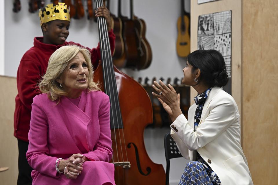 US First Lady Jill Biden, left, and Akshata Murty, wife of Britain's Prime Minster listen to a music class during a visit at the Charles Dickens Primary School in London, Friday May 5, 2023. (Oli Scarff/Pool Photo via AP)