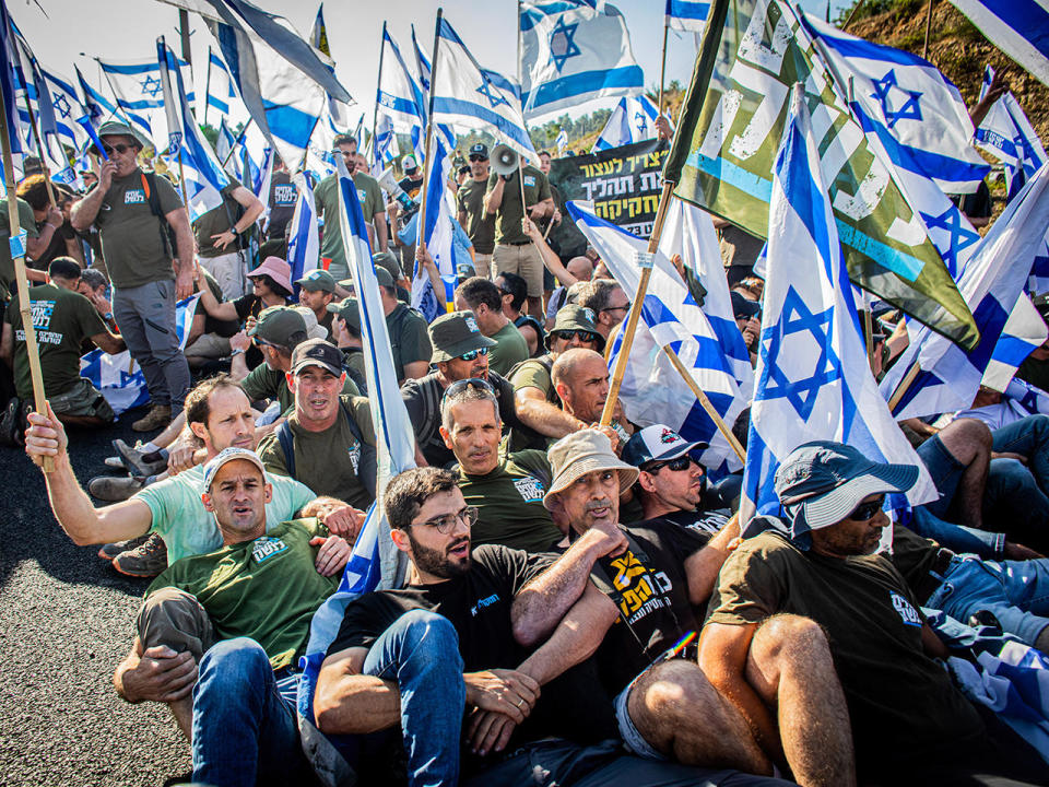 Protesters block the road at the Hemed overpass during a demonstration against the government's controversial judicial reform plans, July 11, 2023. Protests broke out after a bill to remove the power of the Supreme Court to review ministers' decisions passed its first reading in parliament Monday night.  / Credit: Eyal Warshavsky/SOPA Images/LightRocket via Getty Images