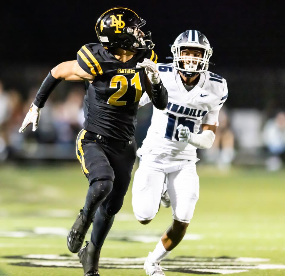Newbury Park receiver Shane Rosenthal looks for the ball after getting behind the Camarillo defense during the Panthers' 35-6 victory at home on Friday, Oct. 27, 2023. Newbury Park secured a share of the Canyon League title.