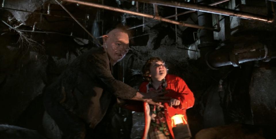 Chunk and Sloth near the pipes in The Goonies