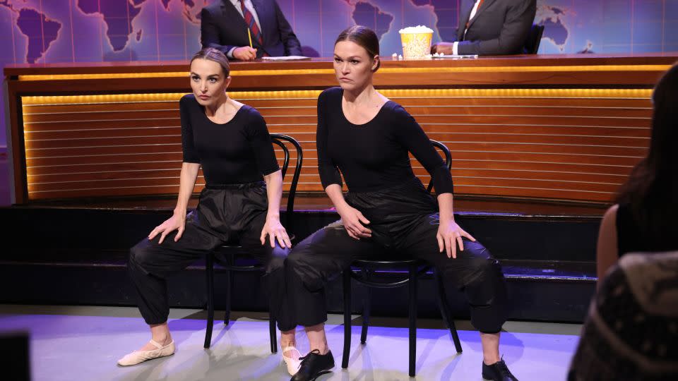 (From left) Colin Jost, Chloe Fineman, Julia Stiles and Michael Che during a 'Weekend Update' sketch on 'Saturday Night Live' in December 2023. - Will Heath/NBC/Getty Images