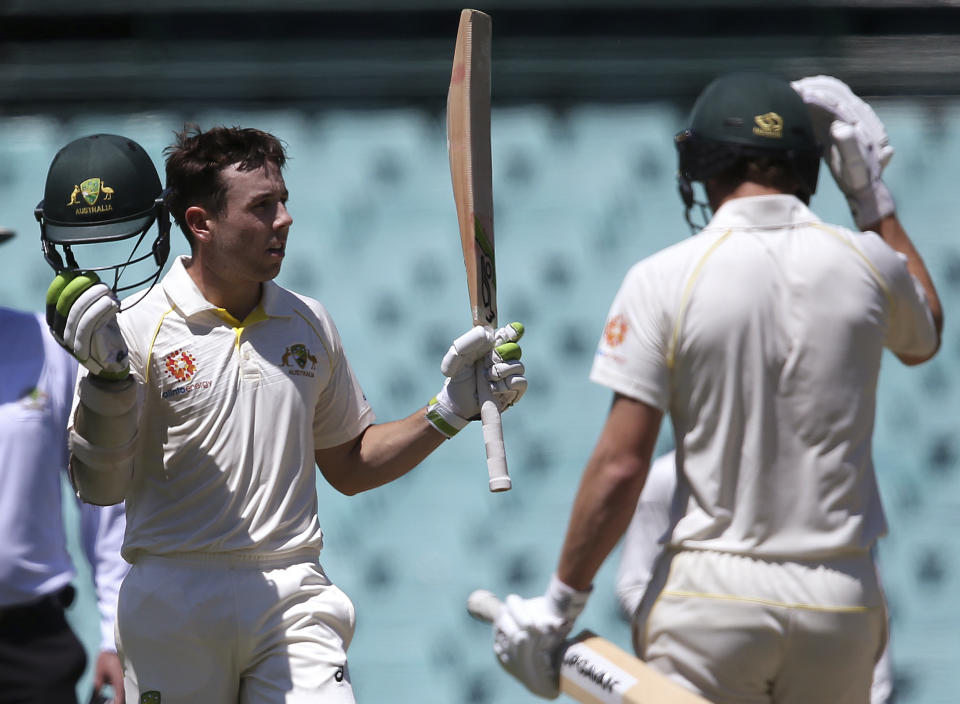 Cricket Australia XI batsman Harry Nielsen, left, celebrates making 100 runs during their tour cricket match against India in Sydney, Saturday, Dec. 1, 2018. (AP Photo/Rick Rycroft)