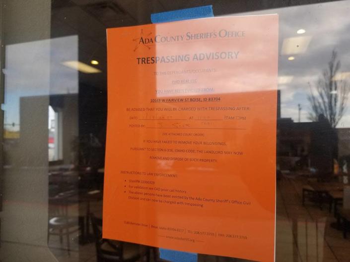 An eviction notice is posted on the window at Pho Tay.