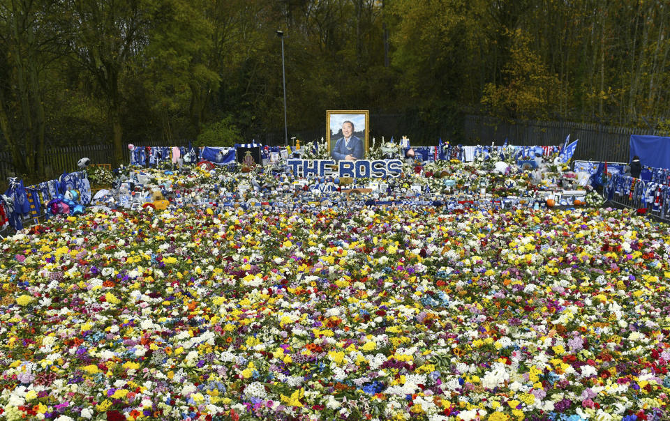 Floral tributes for those who lost their lives in the Leicester City helicopter crach including Leicester City Chairman Vichai Srivaddhanaprabha ahead of the Premier League match at the King Power Stadium, Leicester, England. Saturday Nov. 10, 2018. (Joe Giddens/PA via AP)