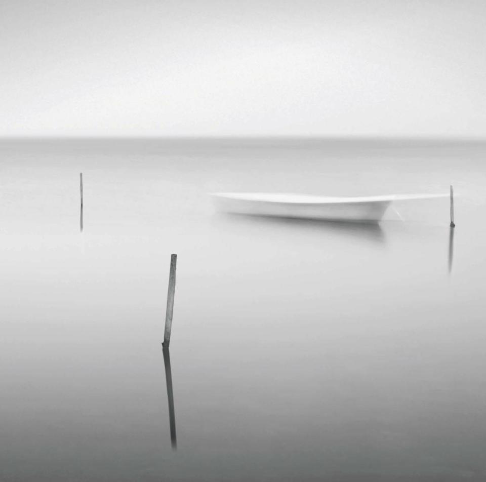 By Jonathan Chritchily: Boat and posts, Camargue, France.