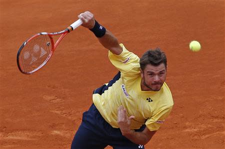 Stanislas Wawrinka of Switzerland serves to Marin Cilic of Croatia during the Monte Carlo Masters in Monaco April 16, 2014. REUTERS/Eric Gaillard